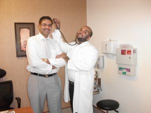 Dr. Loy checking Dr. Tushar